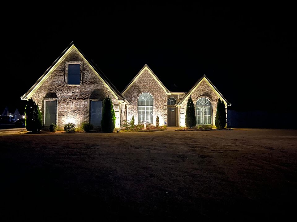 front of house with landscape lighting