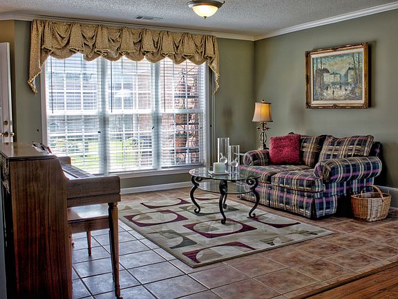 Living Room:  Hardwood/Tile Floors and Custom Window Treatment