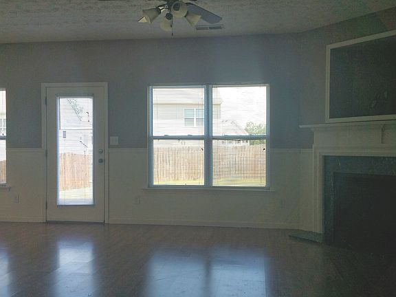 Spacious living room with fireplace and wired alcove for a T