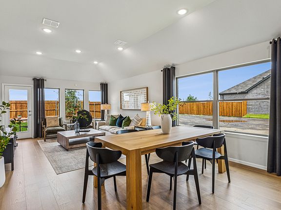 Dining Room in the Turquoise home plan by Trophy Signature Homes - REPRESENTATIVE PHOTO