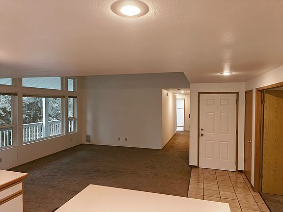 From the kitchen looking toward the living room, entry and main hallway. Office entry on the right.
