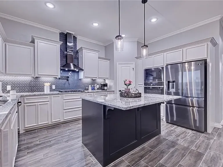 Kitchen featuring a large center island with additional storage and plenty of space for everyday use.