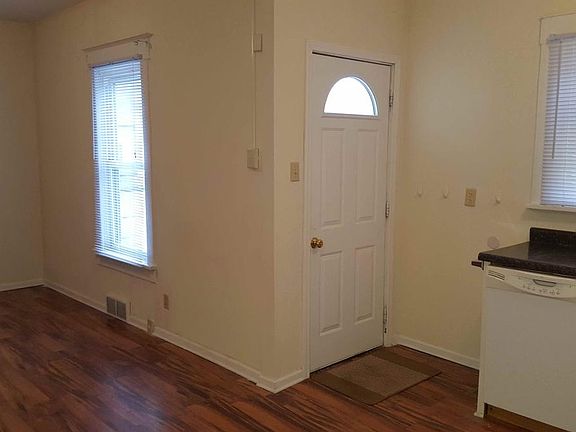 Front entry into open concept kitchen/dining/living area