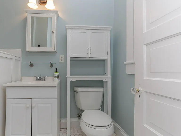 Half bathroom with extra storage space