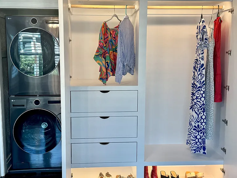 New custom oversized closet with double hanging section, upper shelf, deep drawers, shoe shelf, and motion lighting. New full-size stackable washer and dryer also located in the bedroom and directly next to the custom closet.