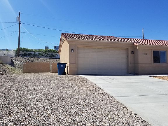Left side of house, RV Electric Hook-Up & Dump in front of man gate.