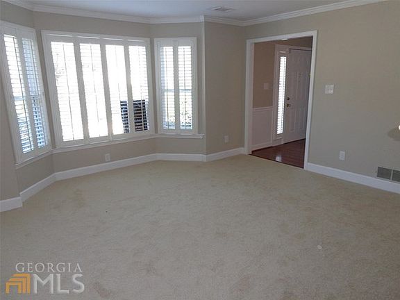 Living Room - Bay Windows Across from Fireplace