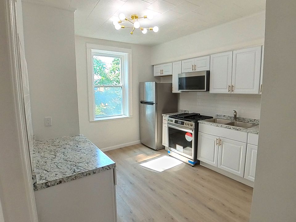 Renovated kitchen with new appliances.