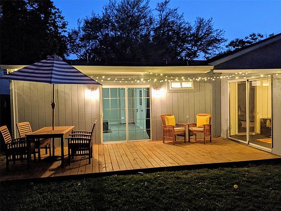 Evening view of wonderful back deck all light up!