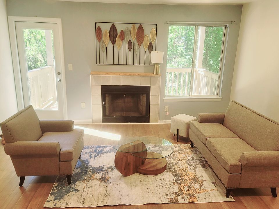 Enjoy lots of natural light and beautiful tree views from the cozy bonus shared living room space.