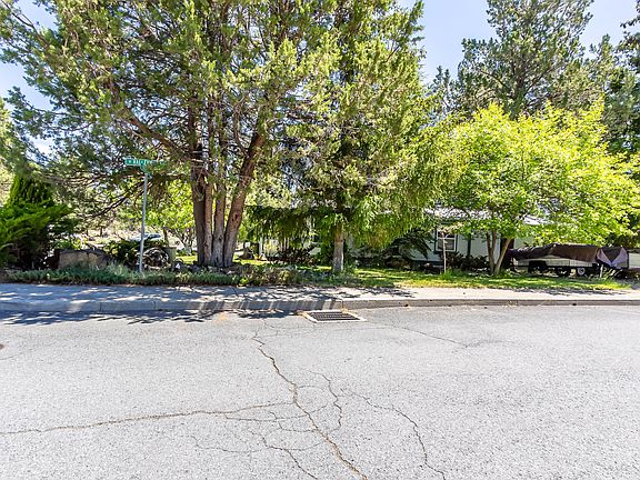 Located on a corner lot at the end of the street abutting the Larkspur Trail