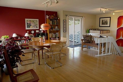 Dining area, stairway and elevator lift in the corner.