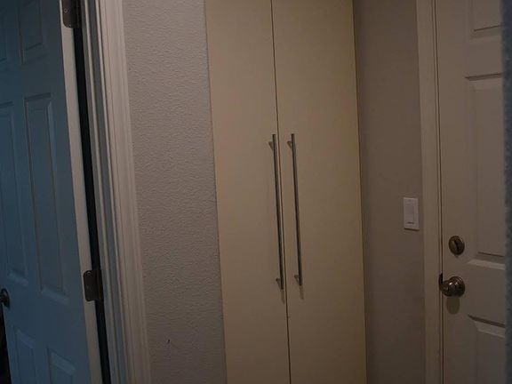 Floor to ceiling built-in shoe cabinet.