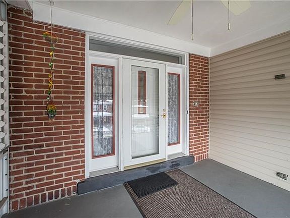 Charming front porch is perfect spot for a swing!