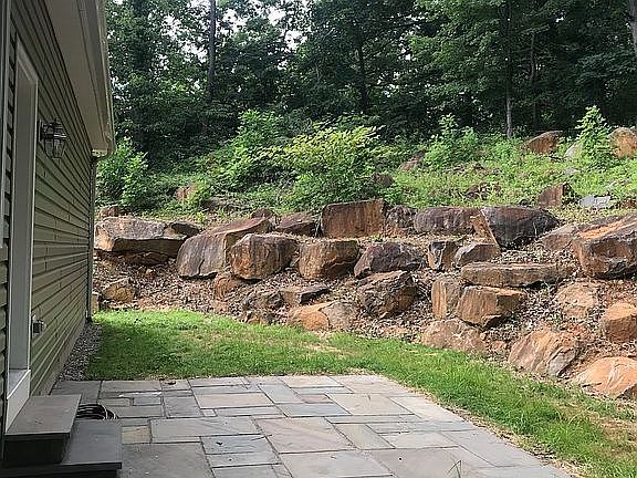 Back patio and terraced rock