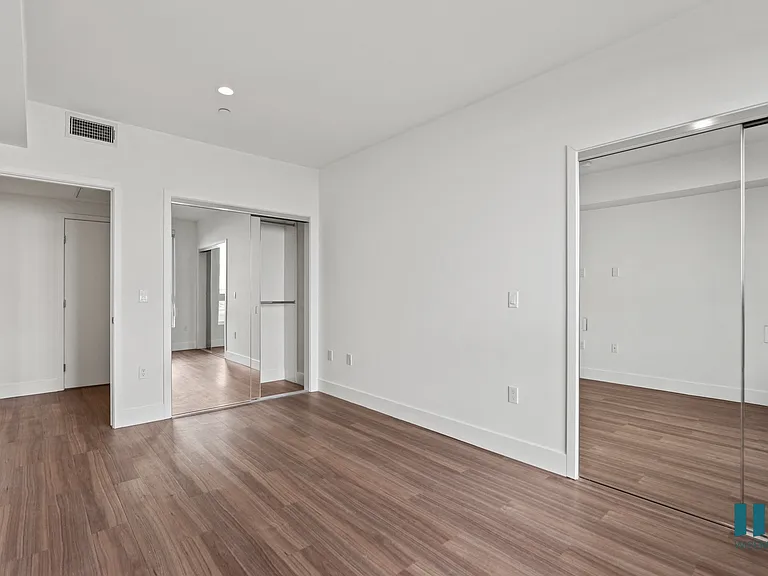 Bedroom with Two Mirrored Closets