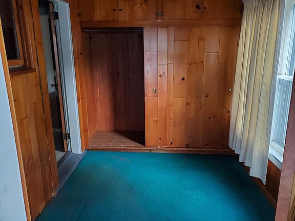 Mudroom, directly off of backporch, connected to kitchen.