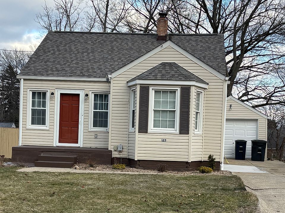 Exterior photo of the home - great curb appeal, new roof (2025), vinyl replacement windows, concrete drive, one car garage. Lawncare included.