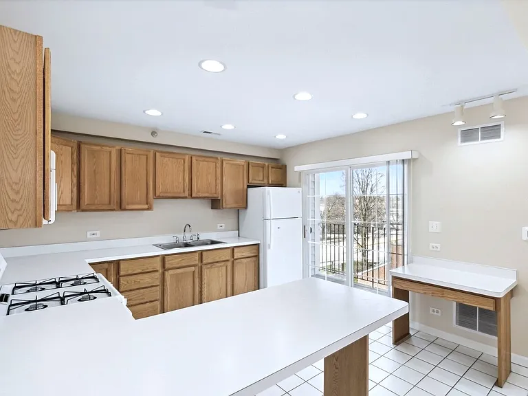 Kitchen bar, utility station & balcony.