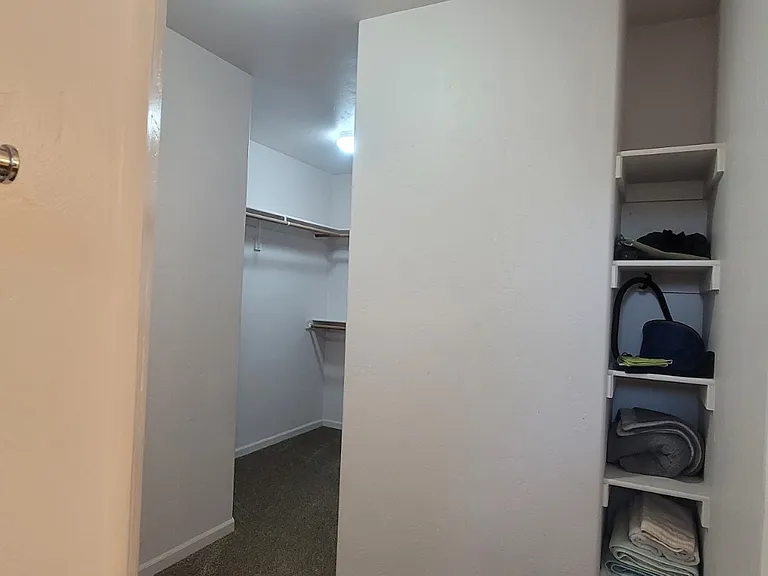 Master bedroom closet looking from bathroom