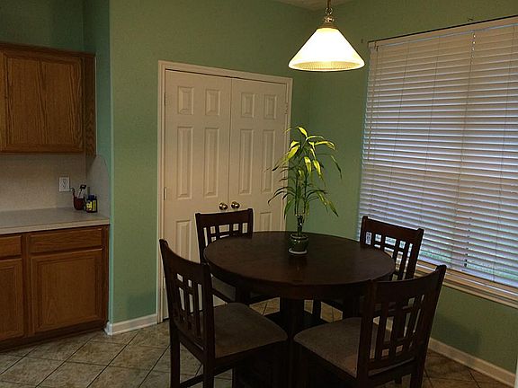 Open breakfast area open to den as well.