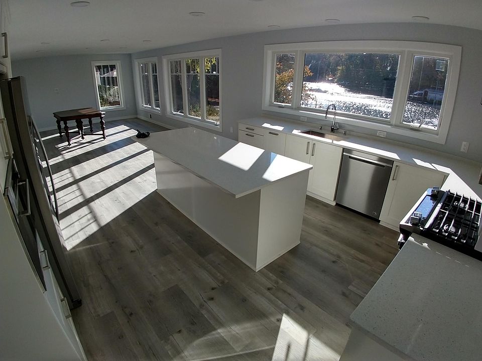Large island, built in microwave, gas stove, refrigerator with ice maker and filtered water, many storage cabinets and soft close drawers.