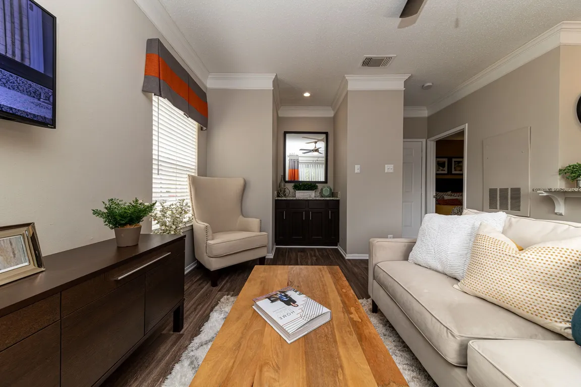 Spacious living room with hardwood-style flooring