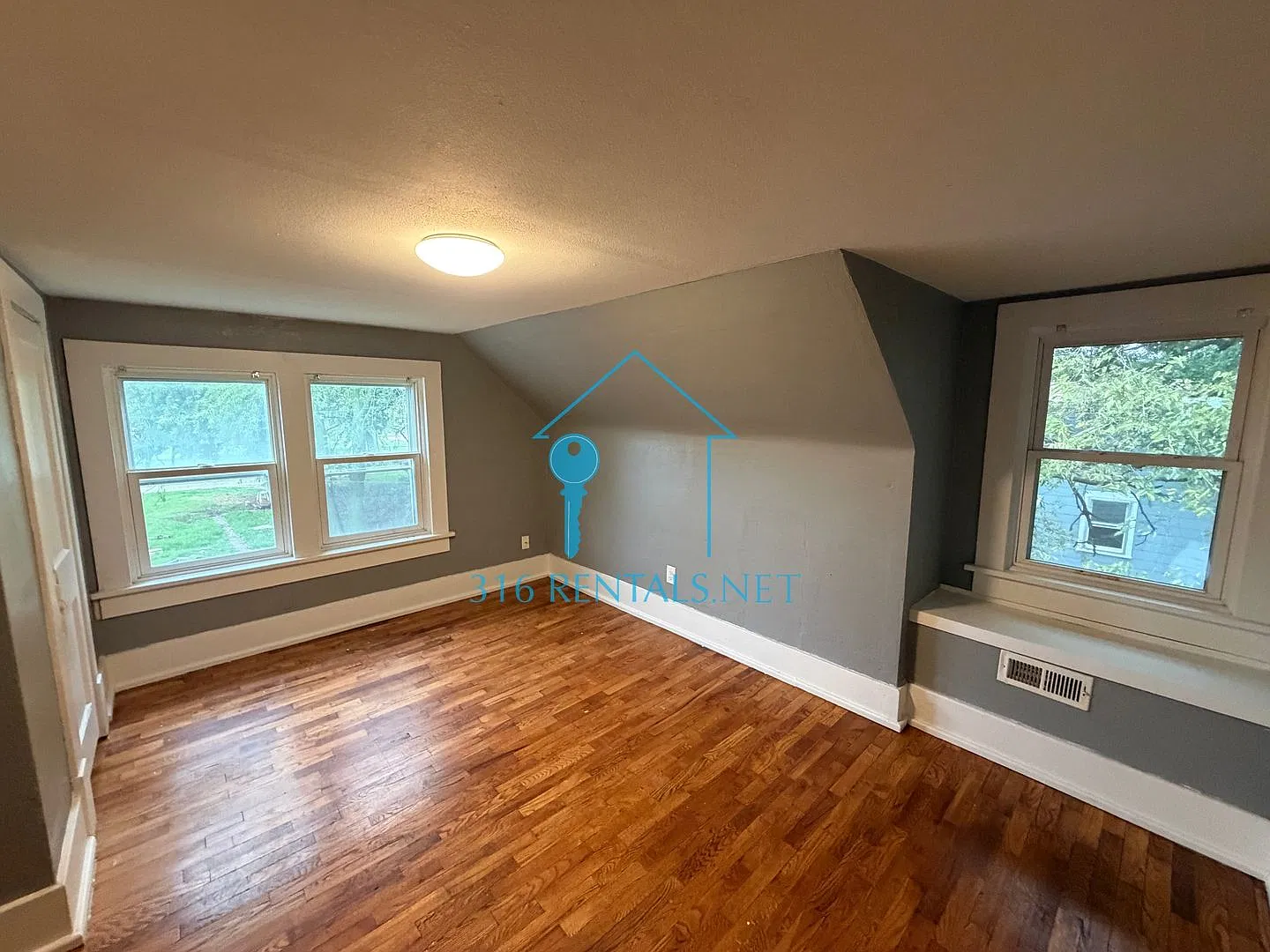 $899 | 2BR Newton Home w/ Hardwood Floors, Fireplace & Fenced Yard | Pets OK — Photo 3