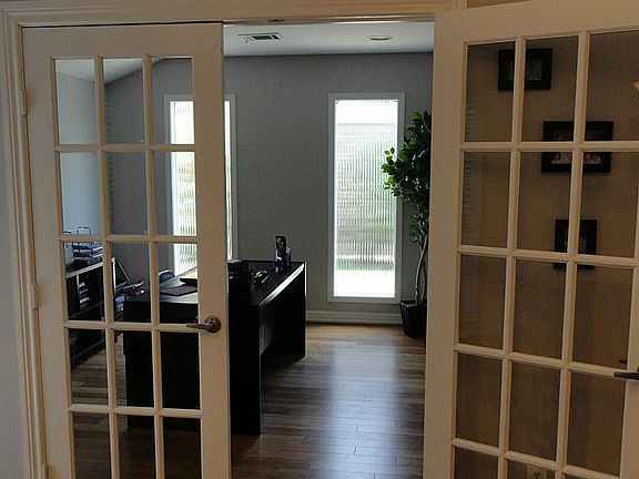 French doors open from formal dining to study, also with bamboo floors