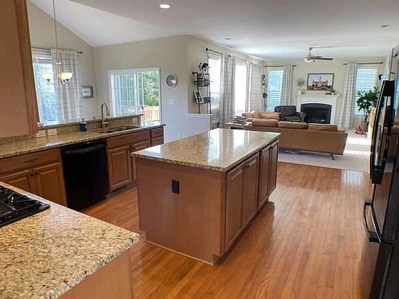 Walk-in pantry on right. Dinning room and Living room behind. All appliances included. Double oven with convection. 5 burner gas range.