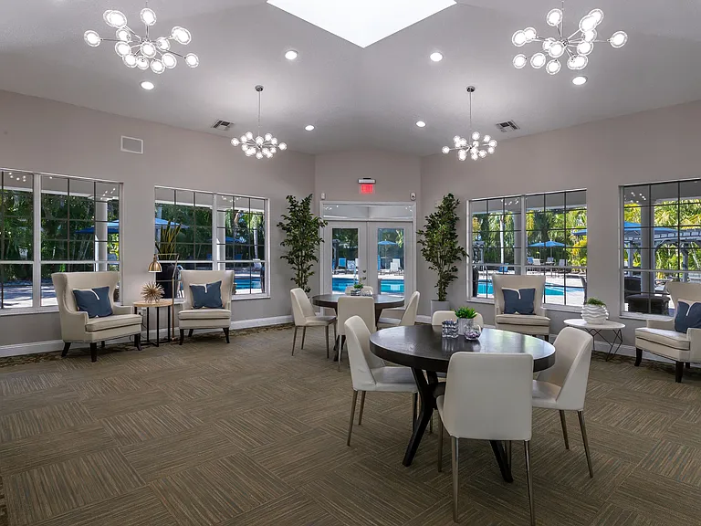 Our clubhouse at Meadow Lakes is designed for comfort and convenience, offering cozy lounge seating, stylish decor, and access to the pool area.