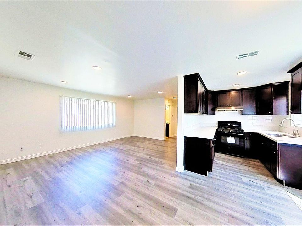 Living area, kitchen, dining area.