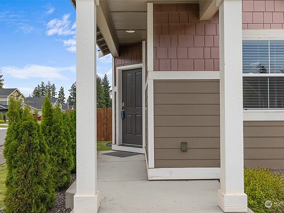 A covered porch welcomes you inside.>