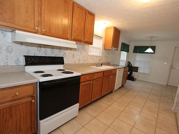 This great kitchen has lots of cabinets and counter top spac