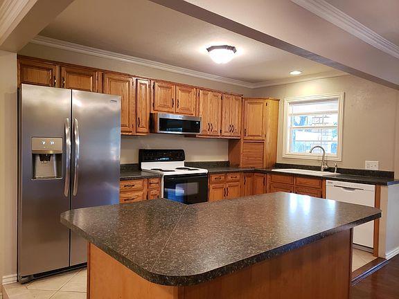 Kitchen with large work bar work area