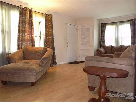 Open, neutral and clean is this great living space.  Nice updated flooring.