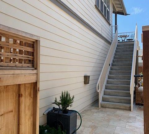 Access is private through backyard via external staircase.