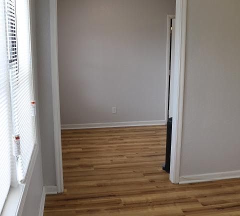 View of living room and dining area from front door