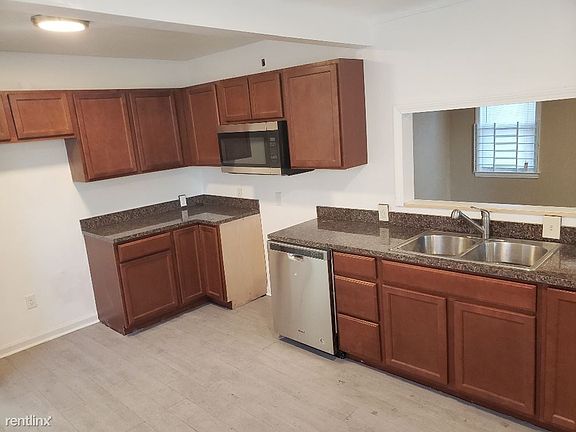 New Kitchen with dishwasher, open view of living room