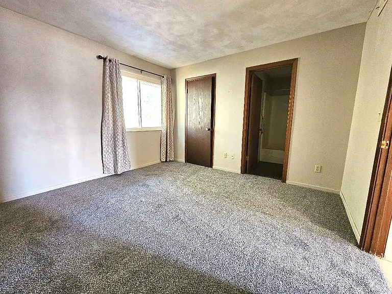 Bedroom with walk-in closet and bathroom