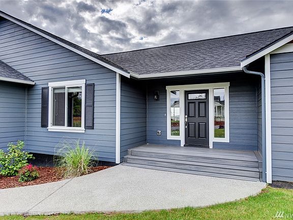 Enter into open living, dining and kitchen with sweeping territorial views. 