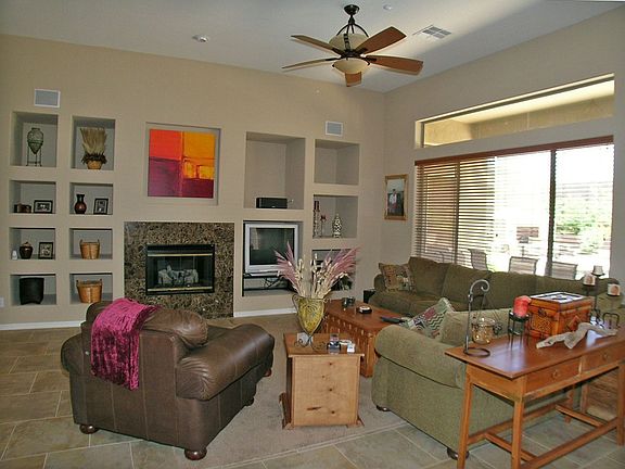 Family room with fireplace and niches.