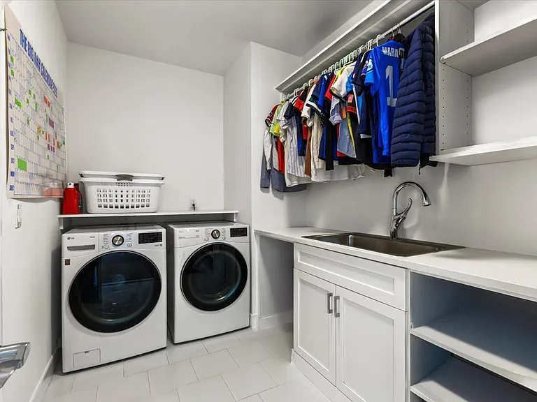 Second floor laundry room w/linen closet
