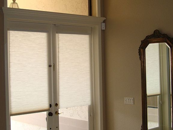 8' French doors and foyer impress guests