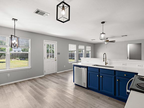 Open concept Chef's kitchen with new quartz countertops, backsplash and stainless steel appliance