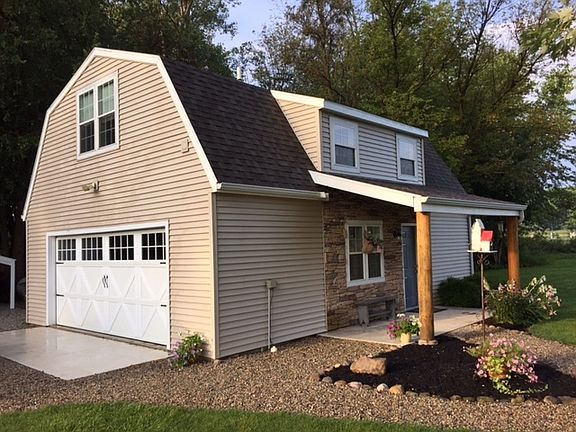 2+ car garage with full second story finished living space with full bath.