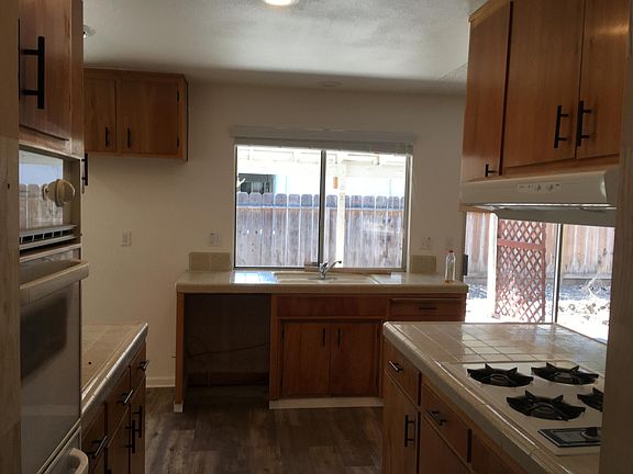 Kitchen with nice window looking out to backyard.
