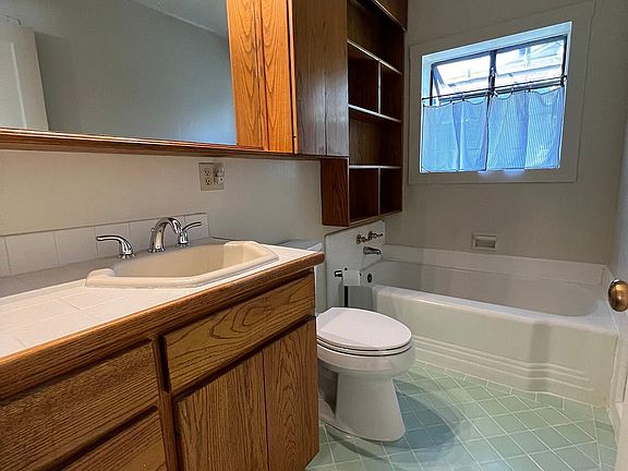 bathroom, large tub and mirror, custom oak cabinets