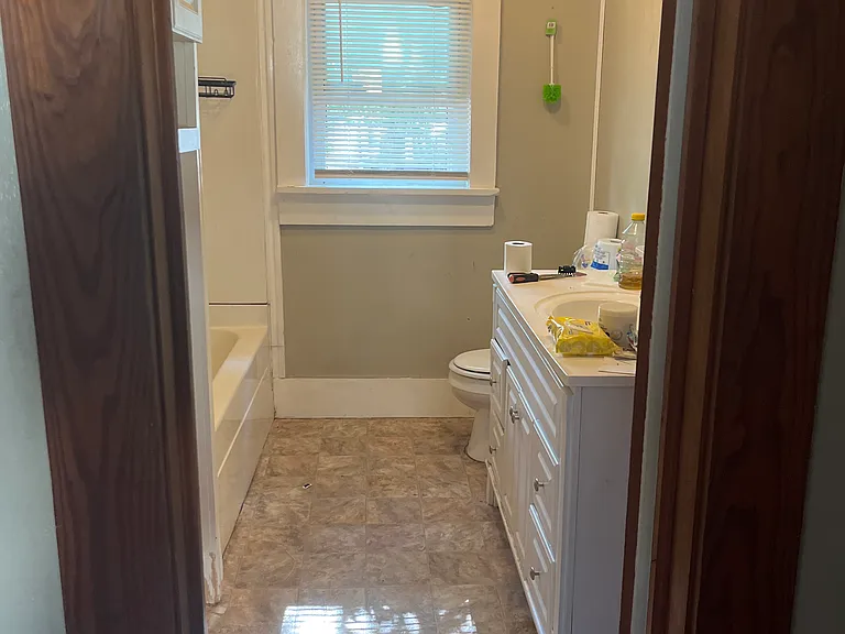 Bathroom with large Vanity, ceiling fan/heat.
