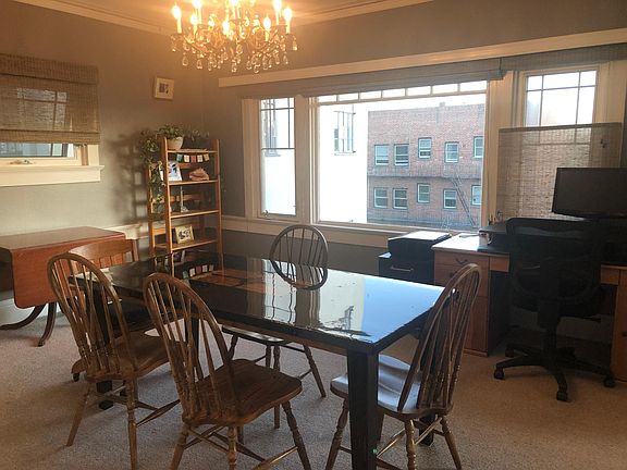 Dining room with workstation on right near window